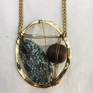 Long chained, stone necklace.